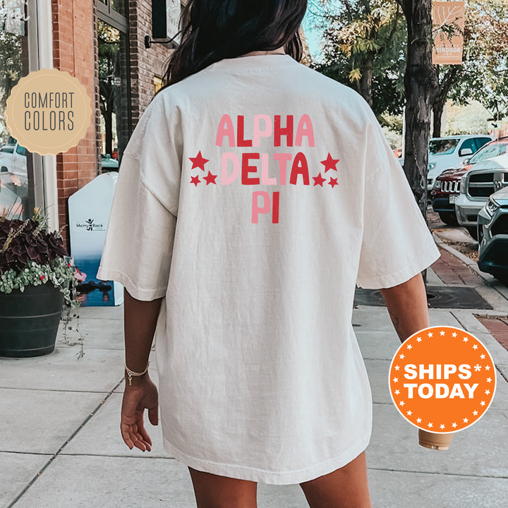 a woman walking down a sidewalk wearing a white shirt