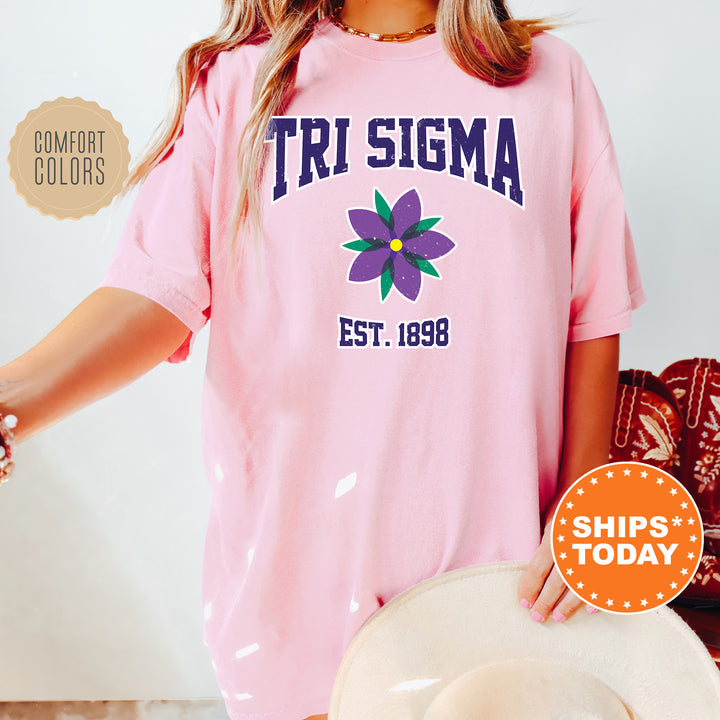 a woman wearing a pink shirt and hat