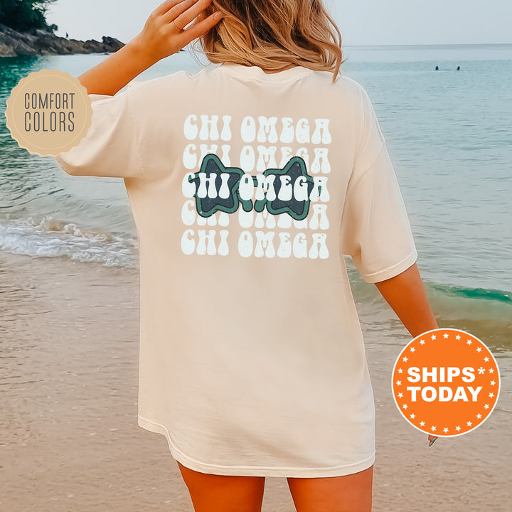 a woman standing on a beach next to the ocean