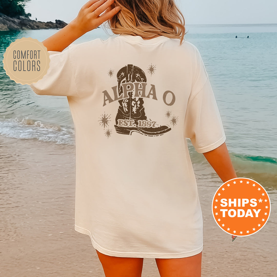 a woman standing on a beach wearing a white shirt