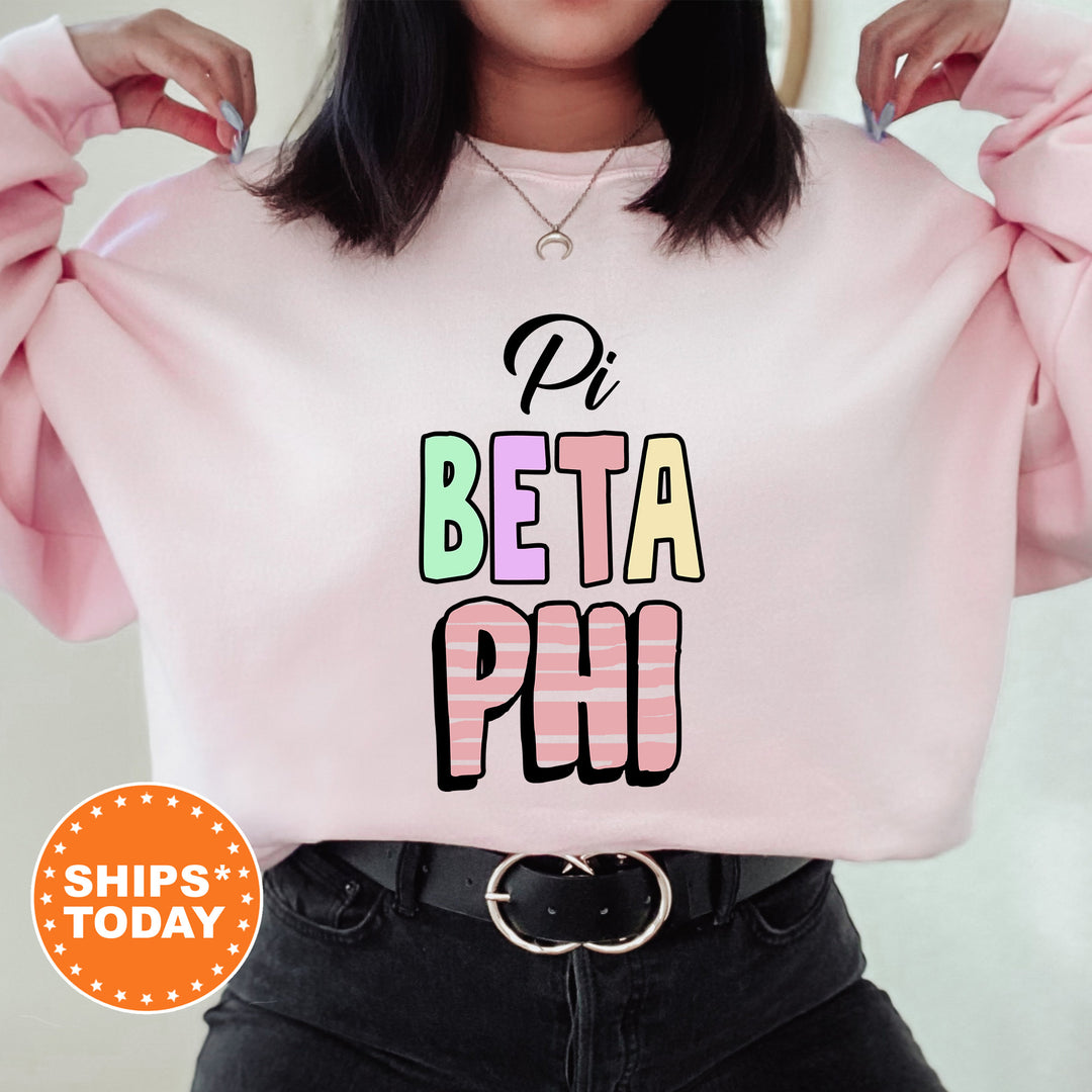 a woman wearing a pink sweatshirt with the words ph beta ph on it