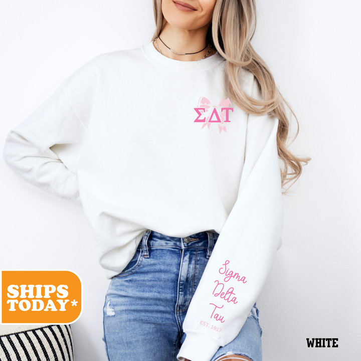 a woman wearing a white sweatshirt and jeans