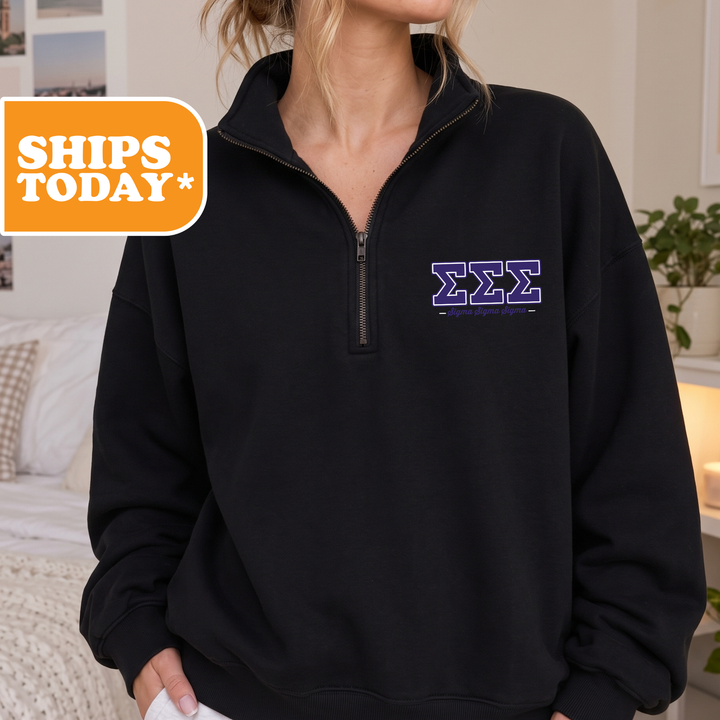 A person wearing a black sweatshirt with a purple Sigma Greek letter logo on the front.
