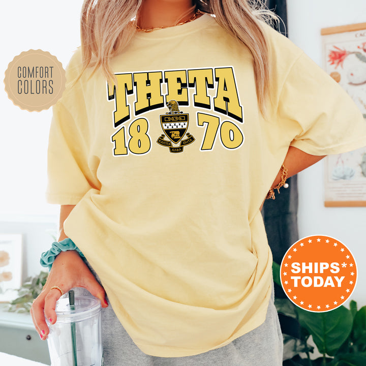 a woman in a yellow shirt holding a blender