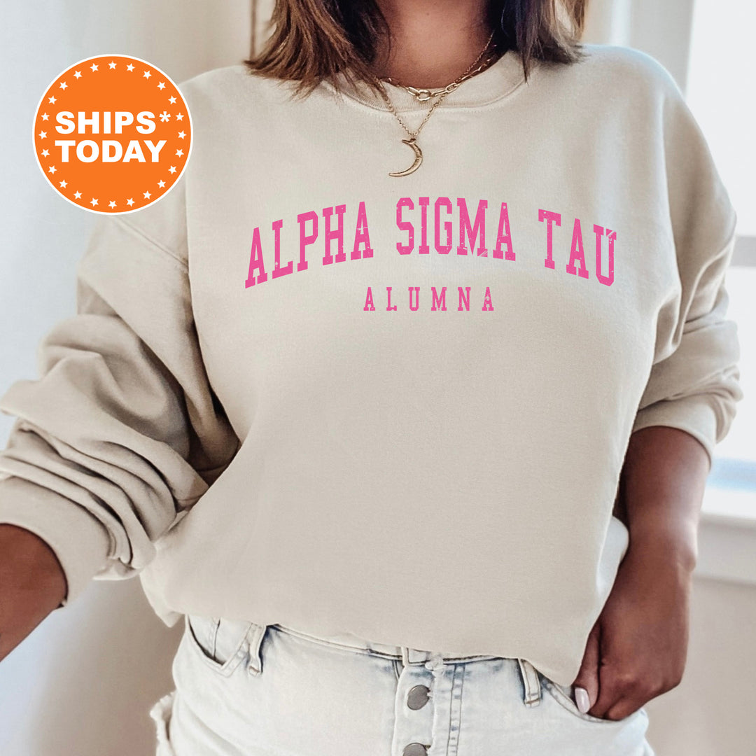 a woman wearing a white sweatshirt with pink letters on it