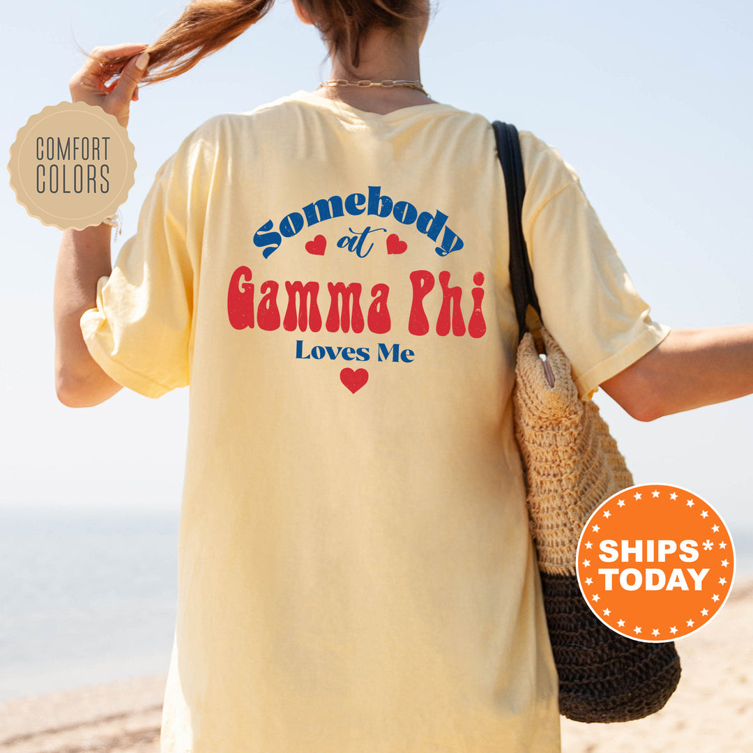 a woman with a bag and a t - shirt that says somebody at the beach