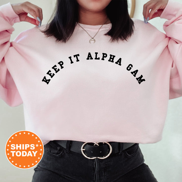 a woman wearing a pink sweatshirt with a slogan on it