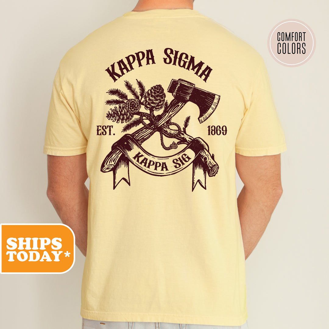 a man wearing a yellow shirt with a hammer and pine cones on it