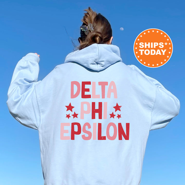 a woman with her back to the camera wearing a white hoodie that says delta