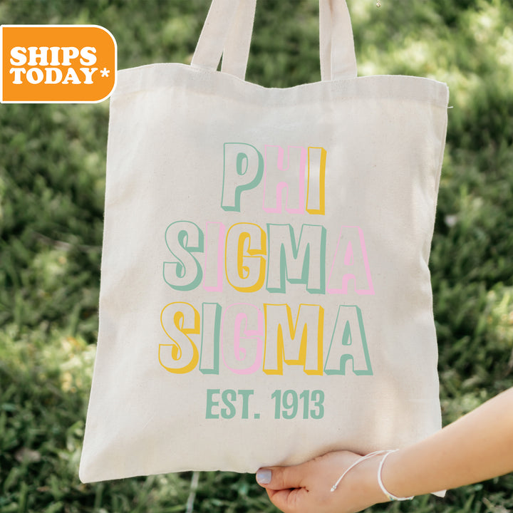 a person holding a tote bag in their hand