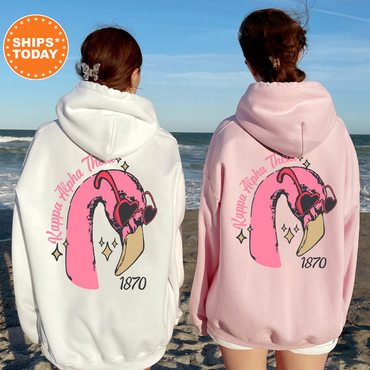 a couple of women standing next to each other on a beach