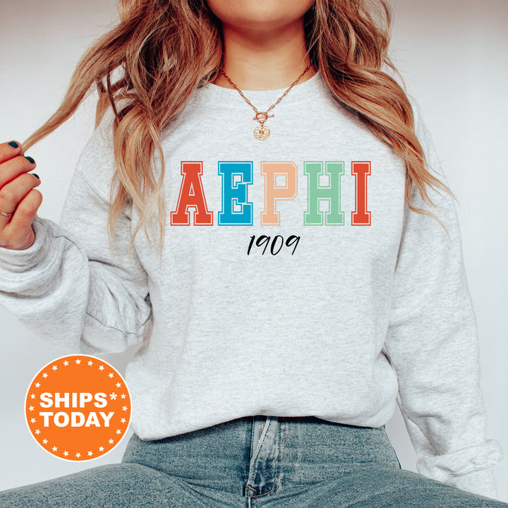 a woman wearing a sweatshirt with the word aephh printed on it