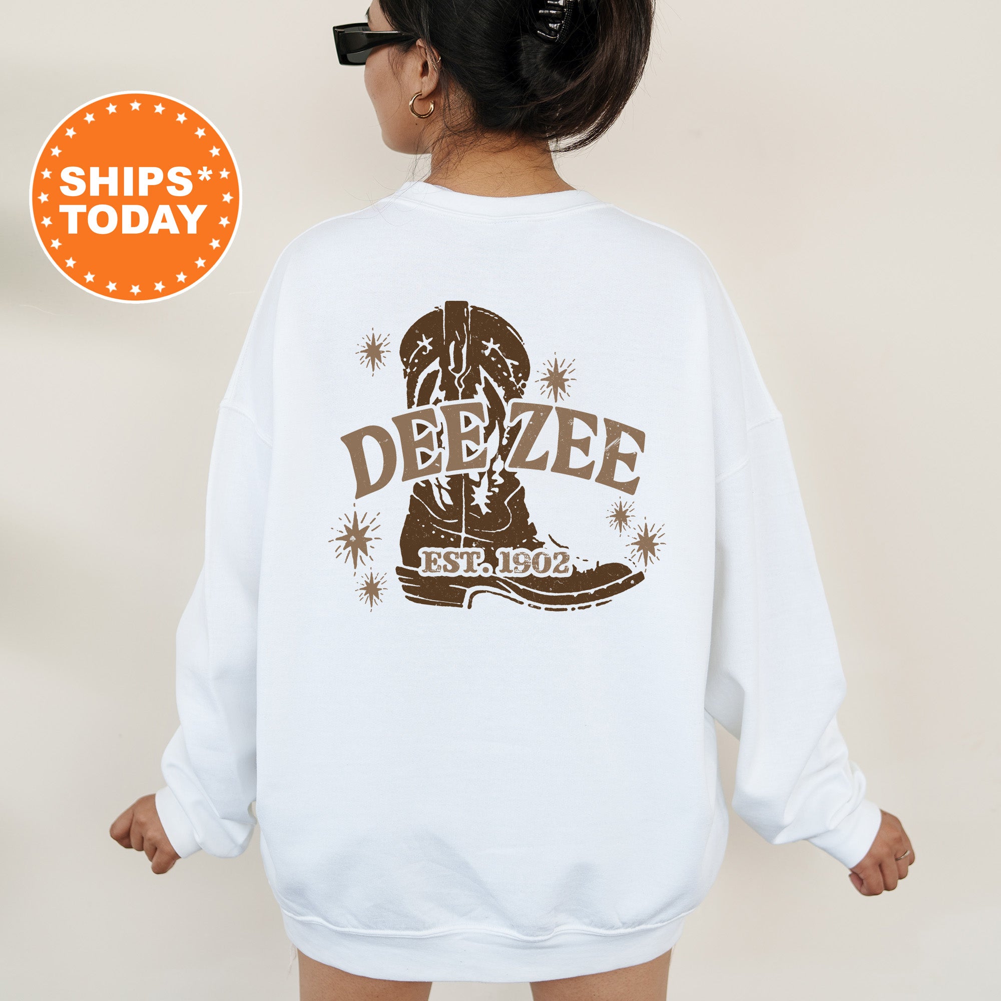 a woman wearing a white sweatshirt with the words deeze on it