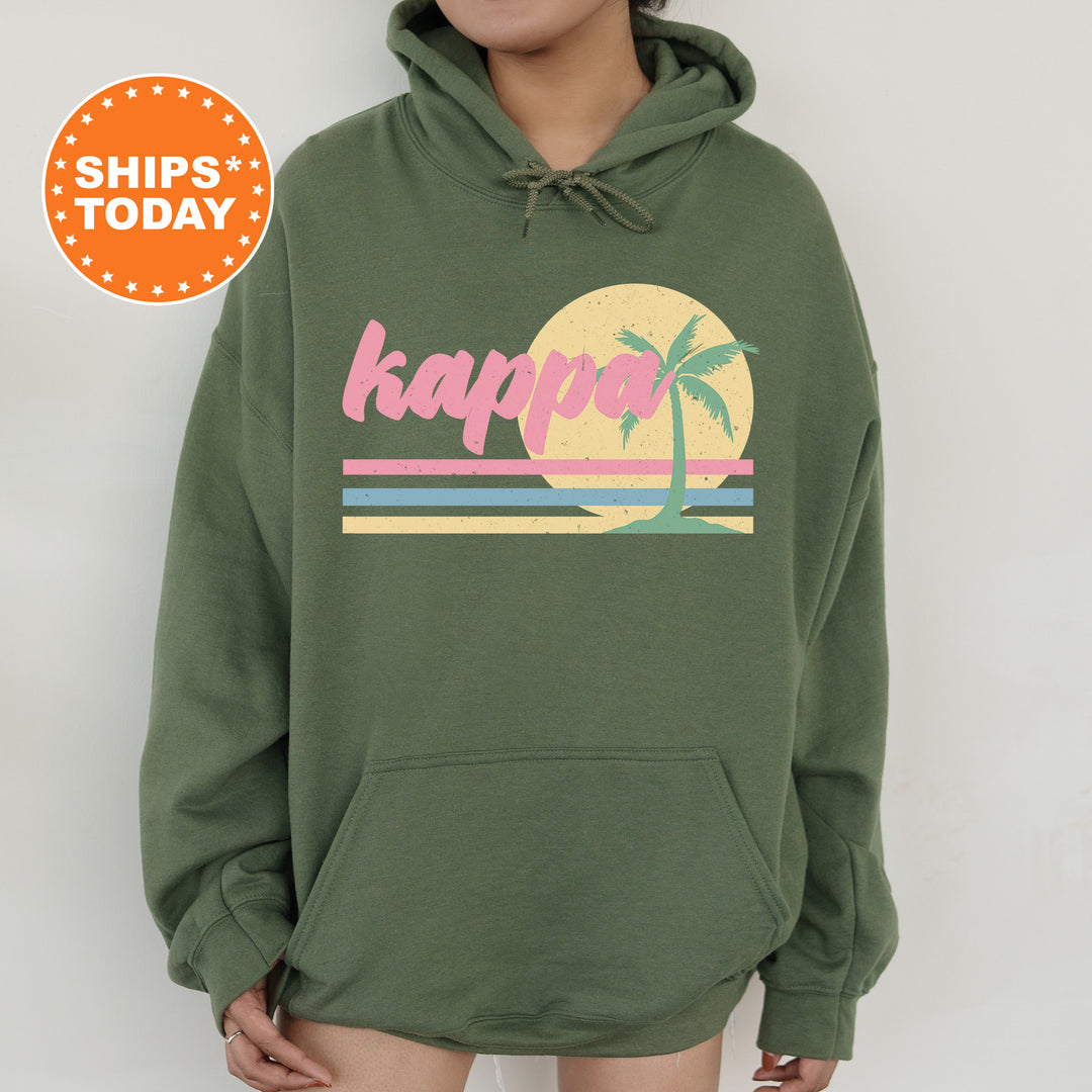 a person wearing a green hoodie with a palm tree on it