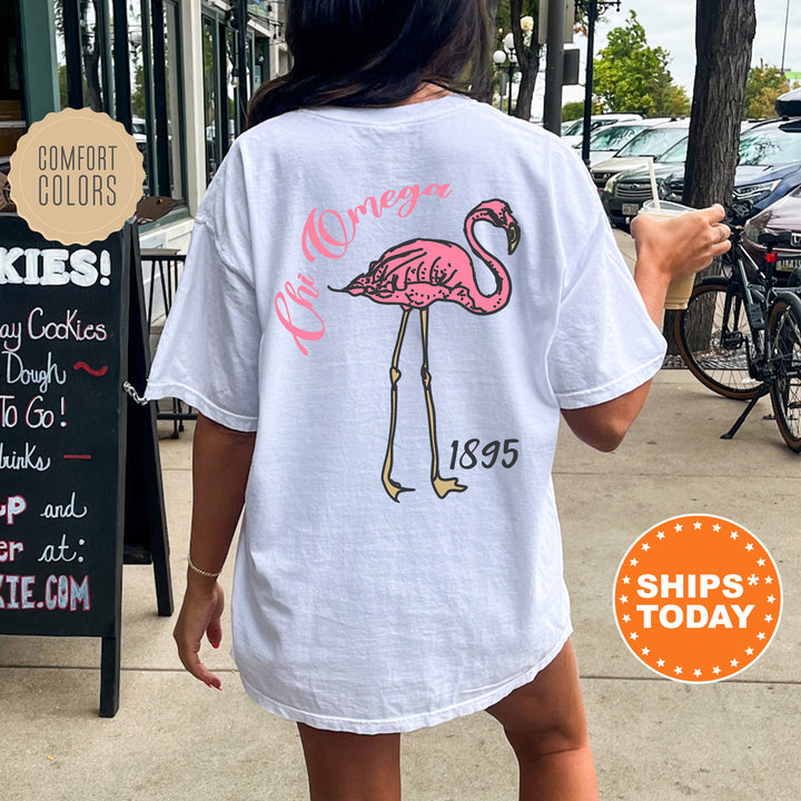 a woman walking down a sidewalk with a pink flamingo shirt on