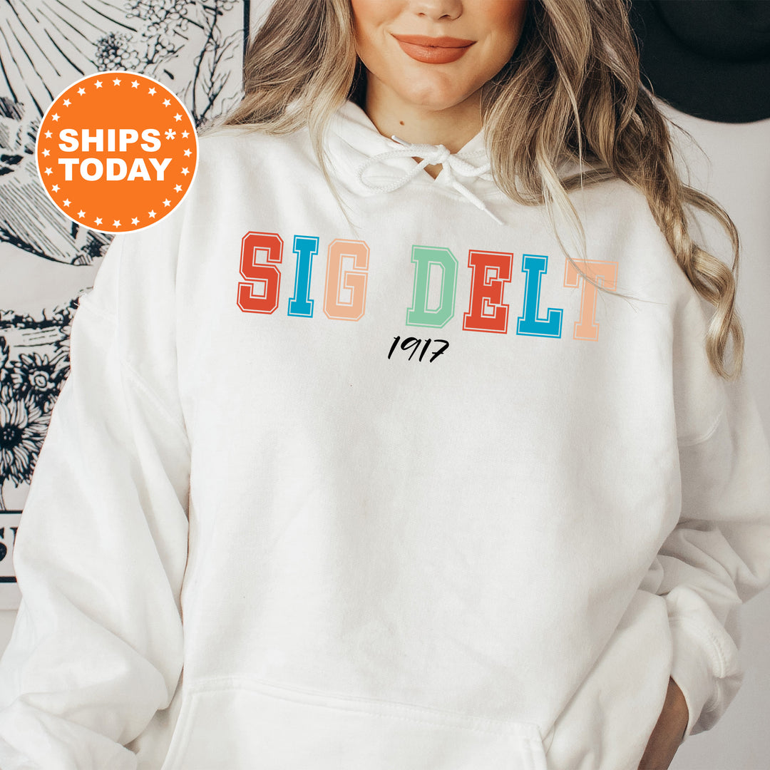 a woman wearing a white sweatshirt with the word sig deli on it