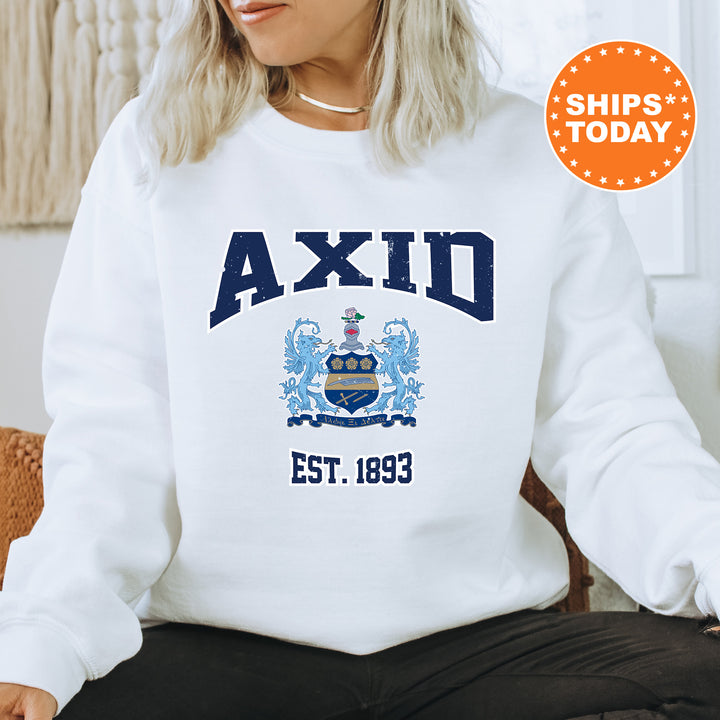 a woman sitting on a chair wearing a white sweatshirt