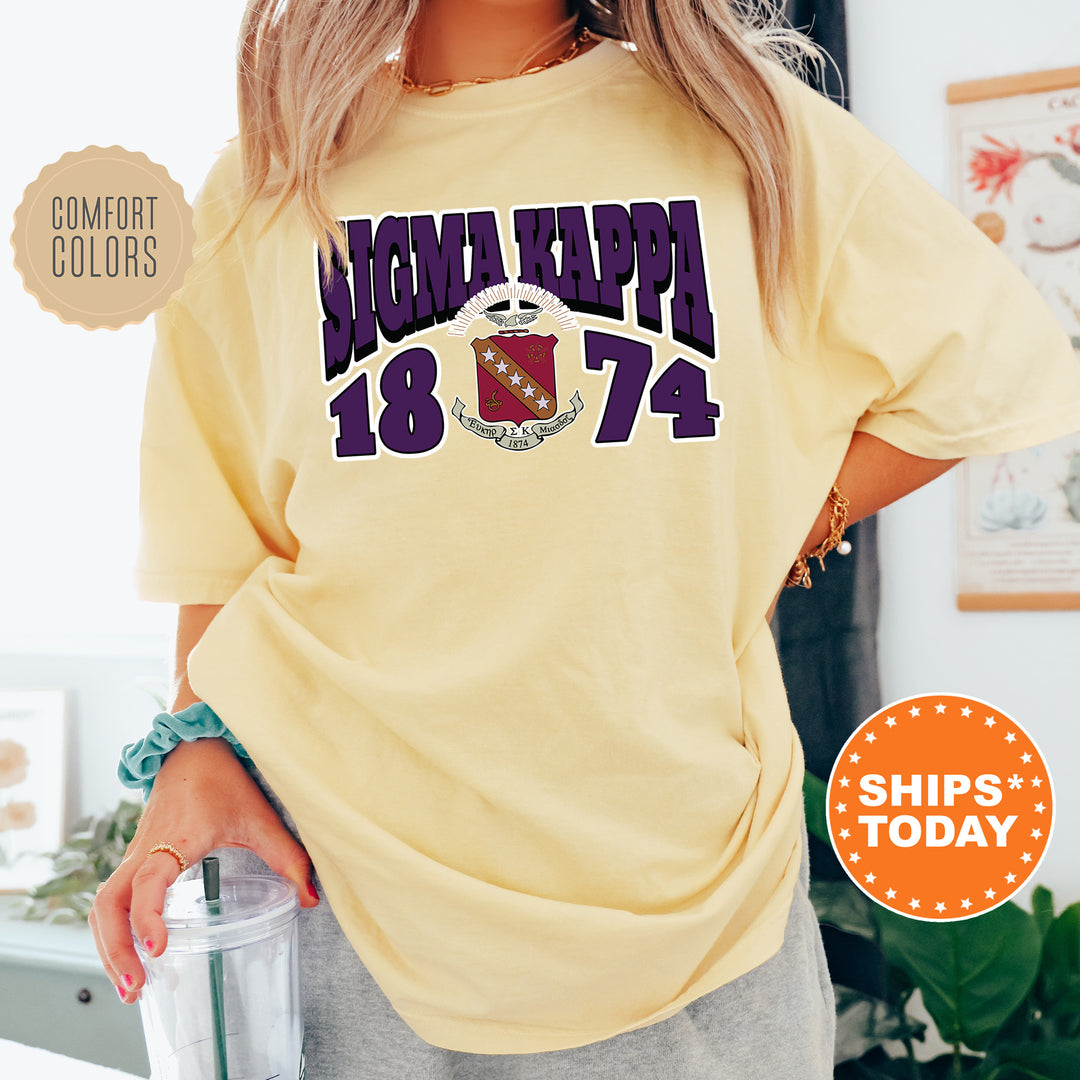 a woman in a yellow shirt is holding a blender