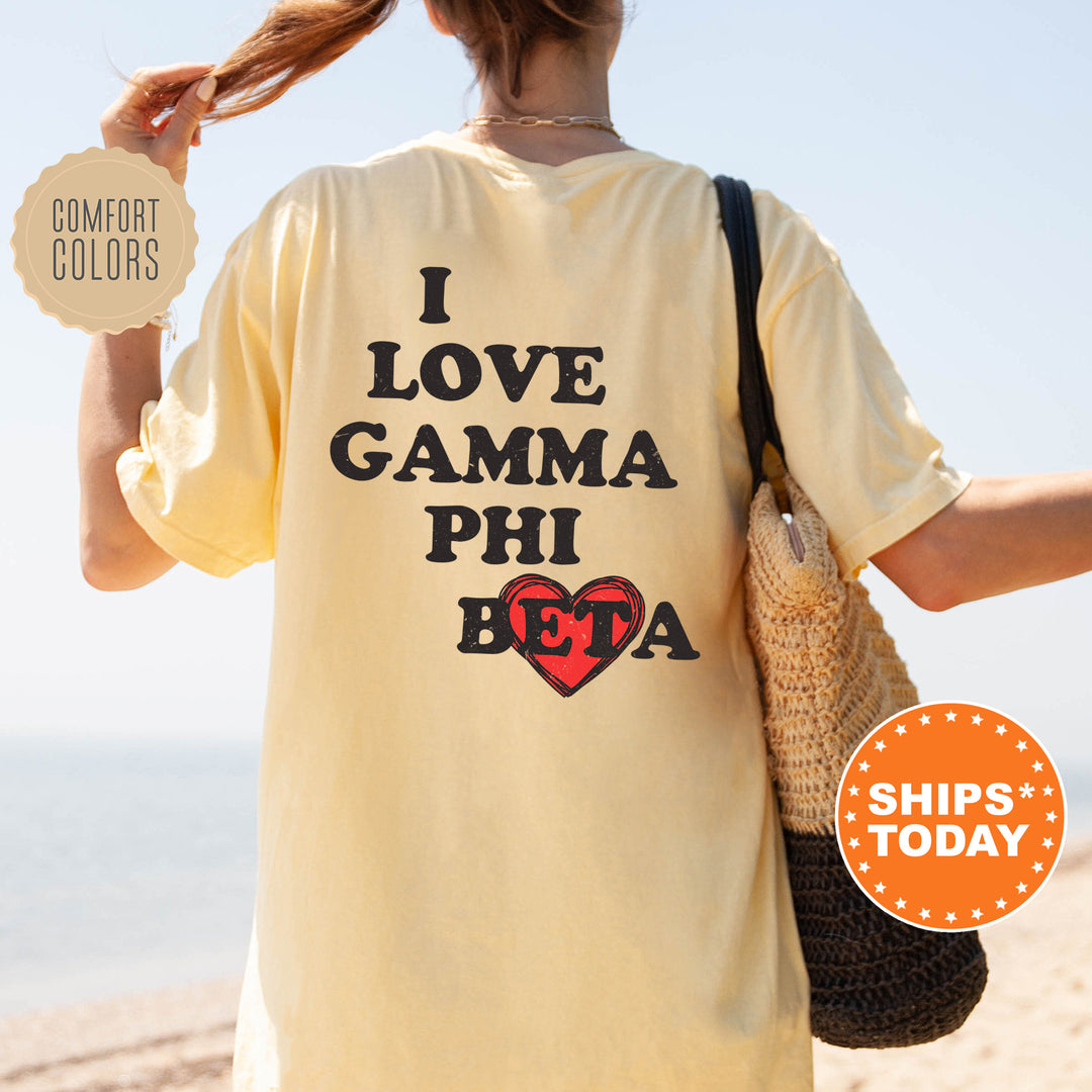 a woman holding a bag and wearing a t - shirt that says i love ga
