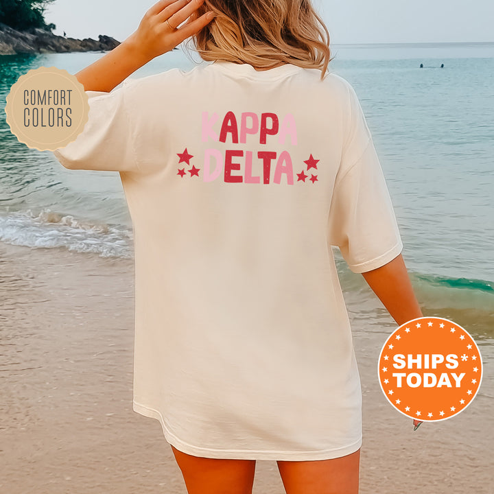 a woman standing on a beach wearing a t - shirt that says appletta