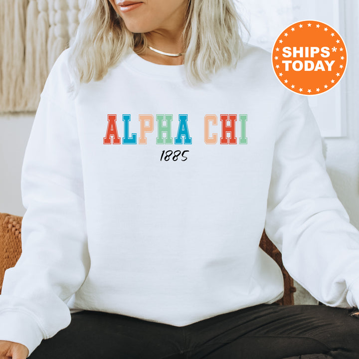 a woman sitting on a chair wearing a white sweatshirt