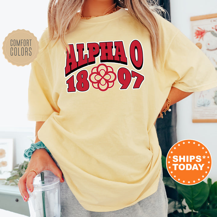 a woman wearing a yellow shirt with the words alpeao on it