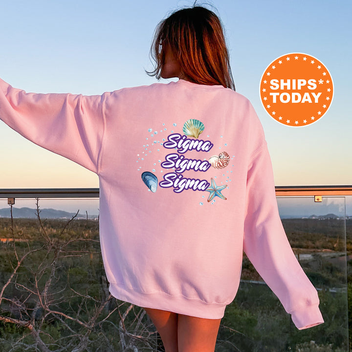 a woman wearing a pink sweatshirt with a slogan on it