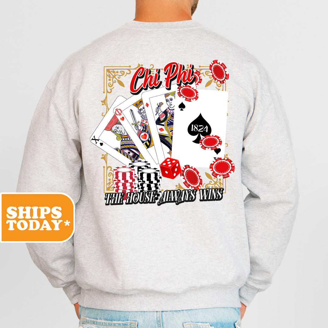 a man wearing a sweatshirt that has a picture of playing cards on it