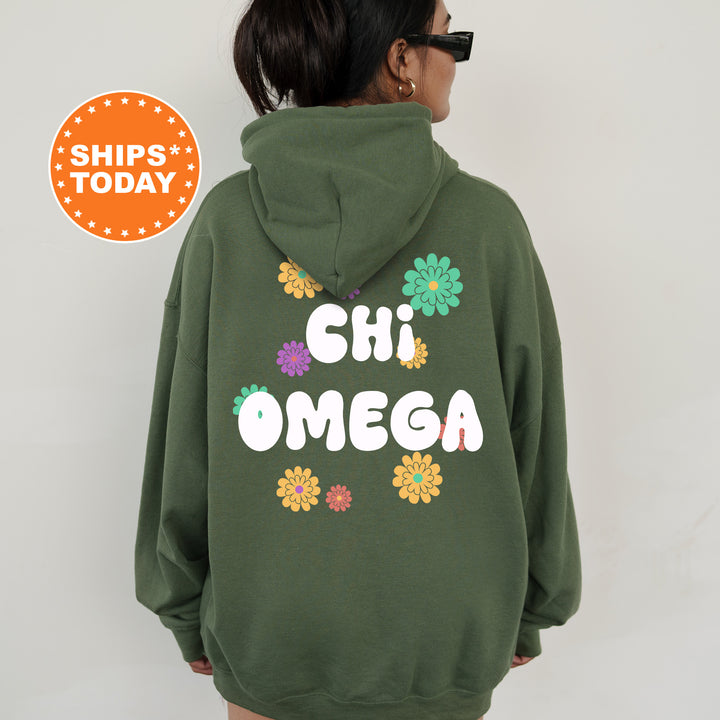 a woman wearing a green hoodie that says chii omega