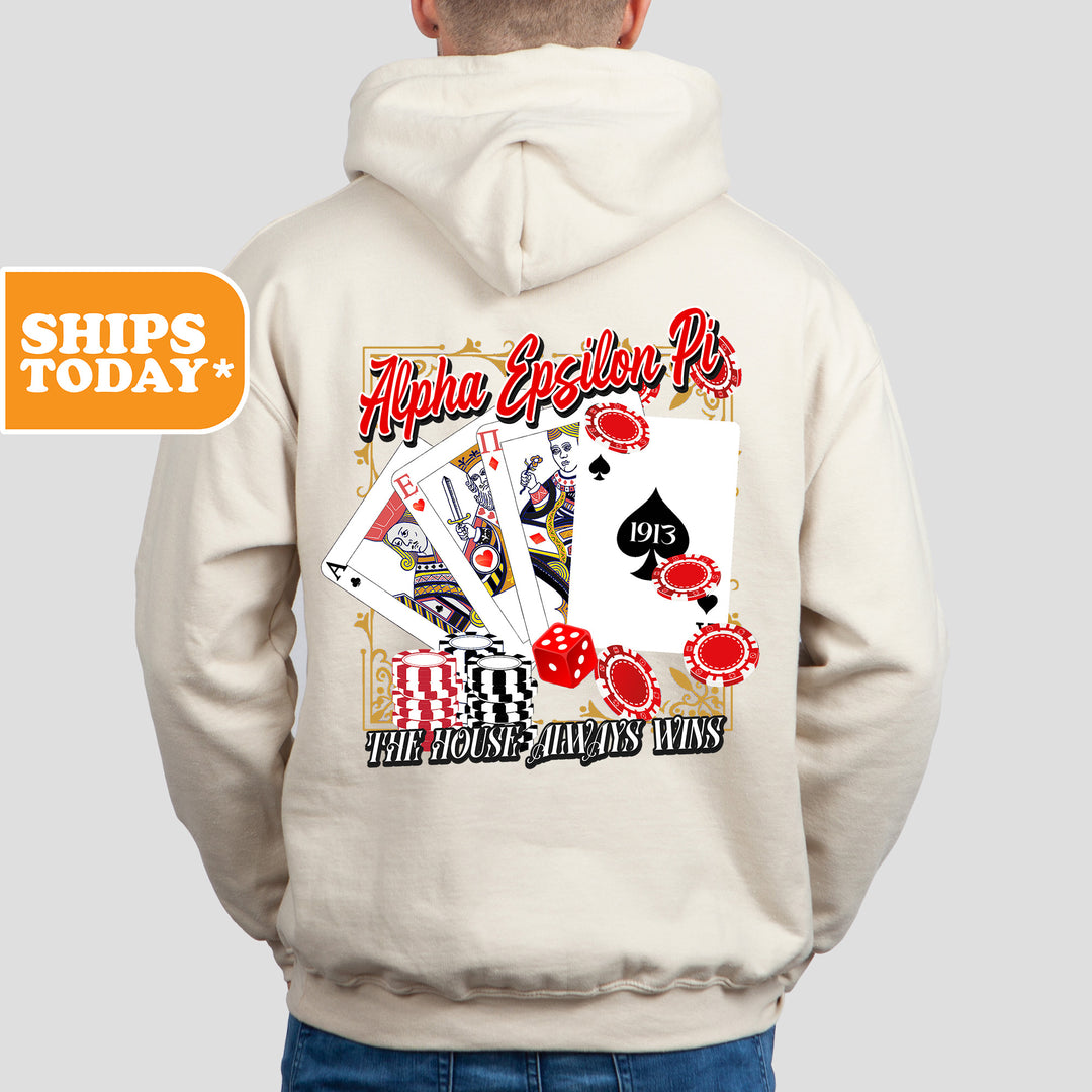 a man wearing a white hoodie with a card design on it