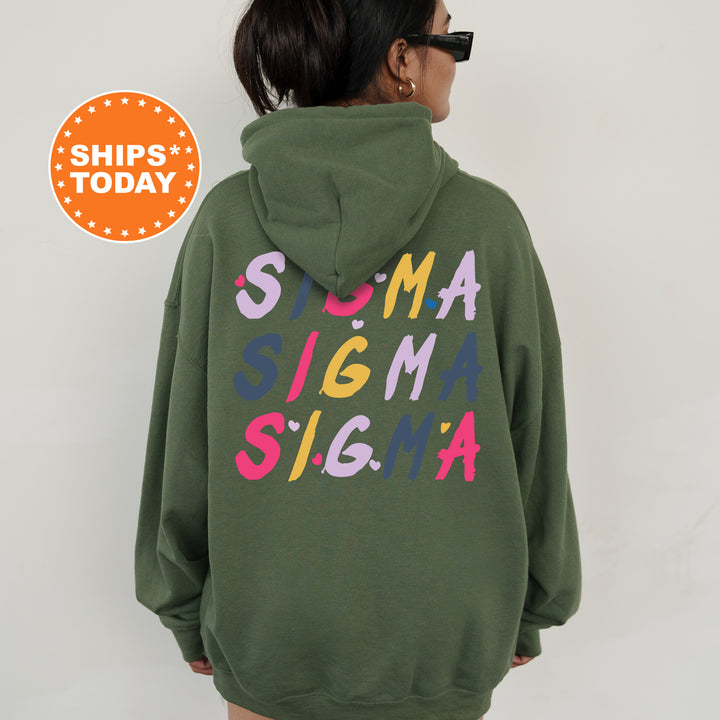 a woman wearing a green sweatshirt with the words stigma stigma on it