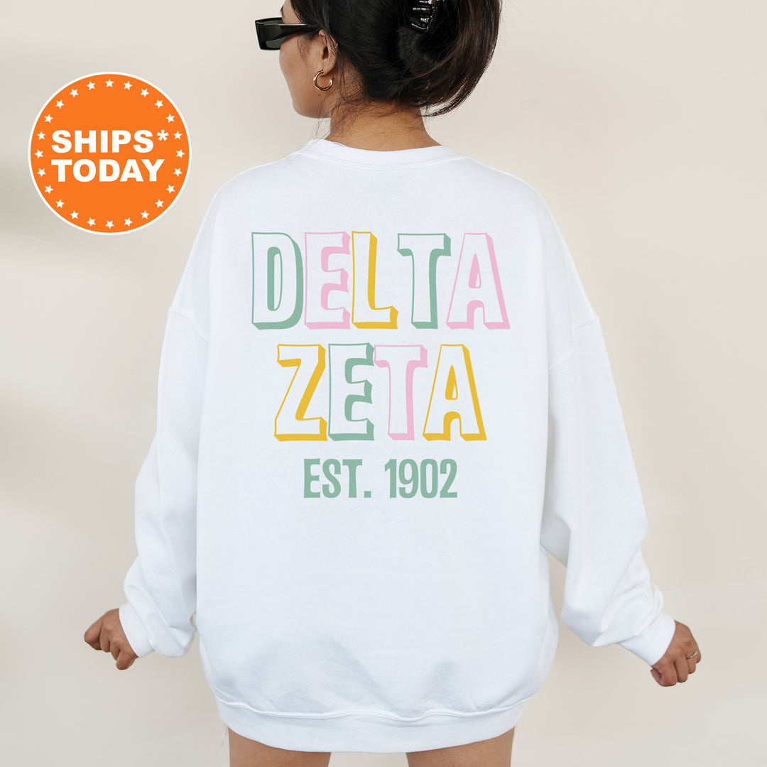 a woman wearing a white sweatshirt with the words delta zera printed on it