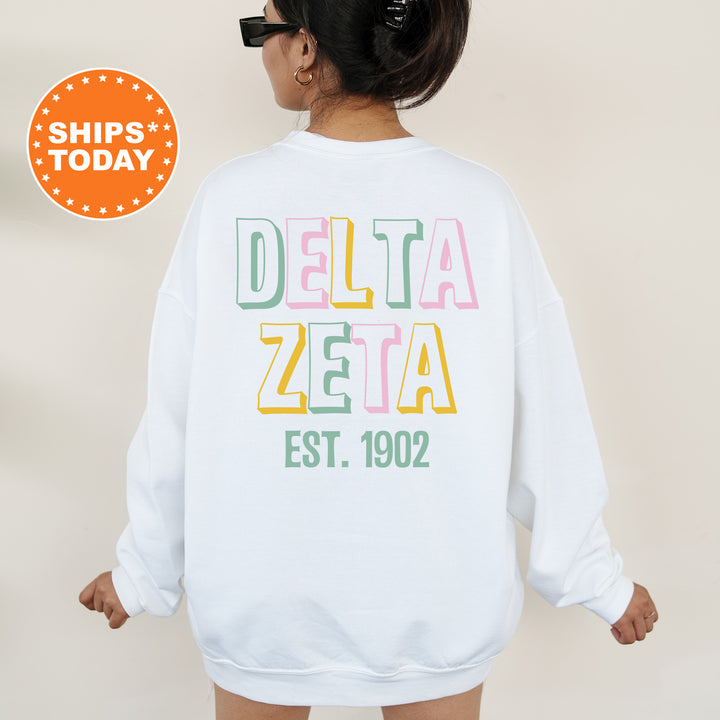 a woman wearing a white sweatshirt with the words delta zera printed on it