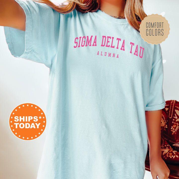 a woman wearing a shirt that says stigma delta tau