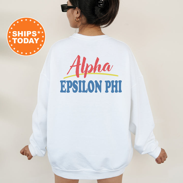 A person wearing a white sweatshirt with the text "Alpha Epsilon Phi" printed on the back.