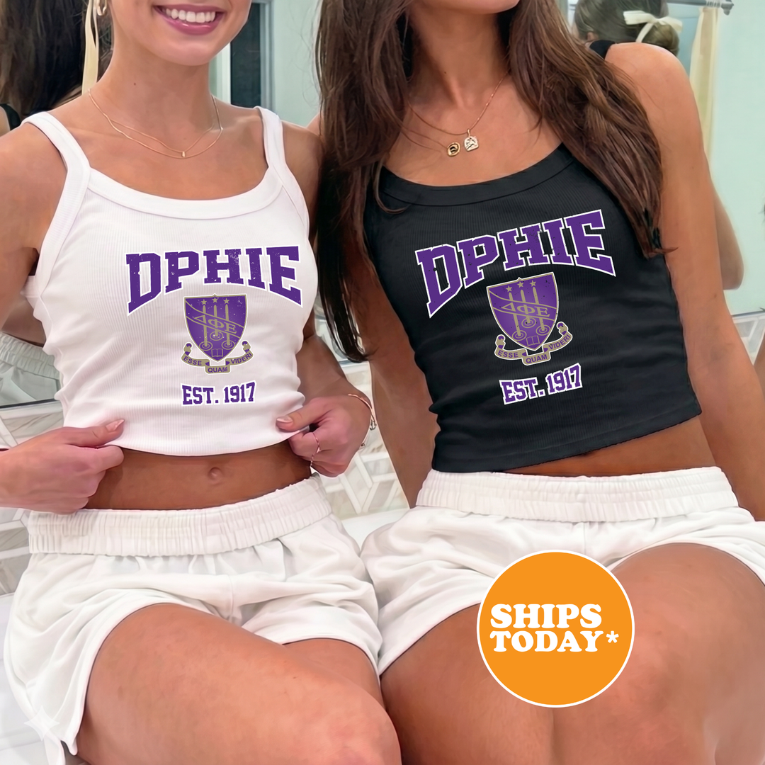 Two women wearing tank tops with the same design, smiling and posing together.