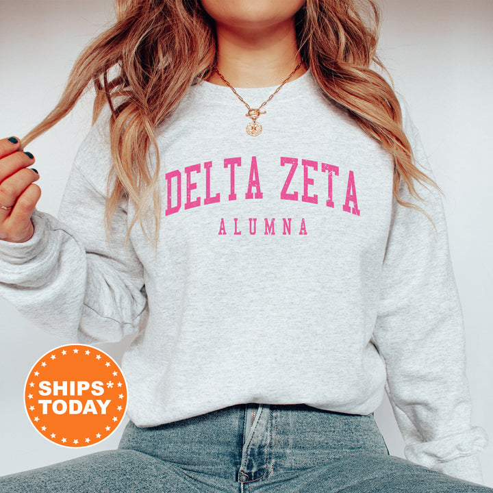 a woman with long hair wearing a delta delta sweatshirt