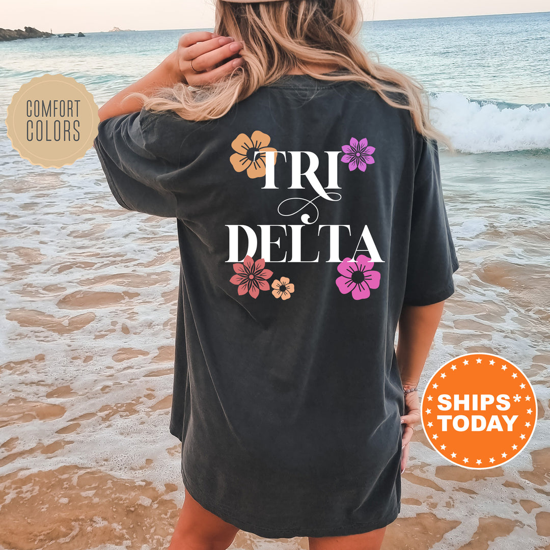 a woman standing on a beach wearing a t - shirt that says tru de