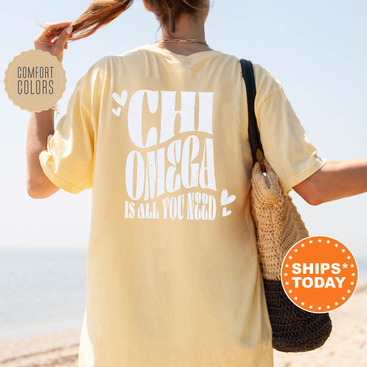 a woman walking on a beach holding a bag