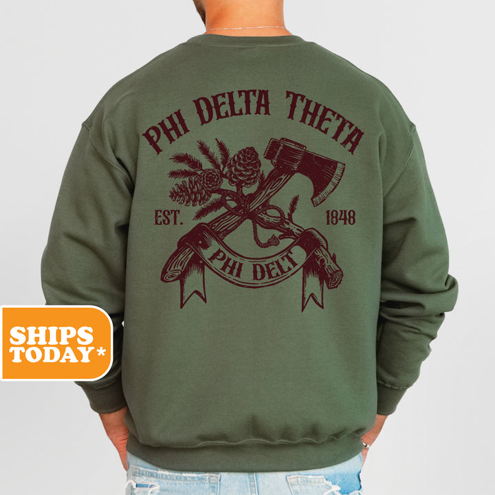 a man wearing a phi delta sweatshirt and jeans