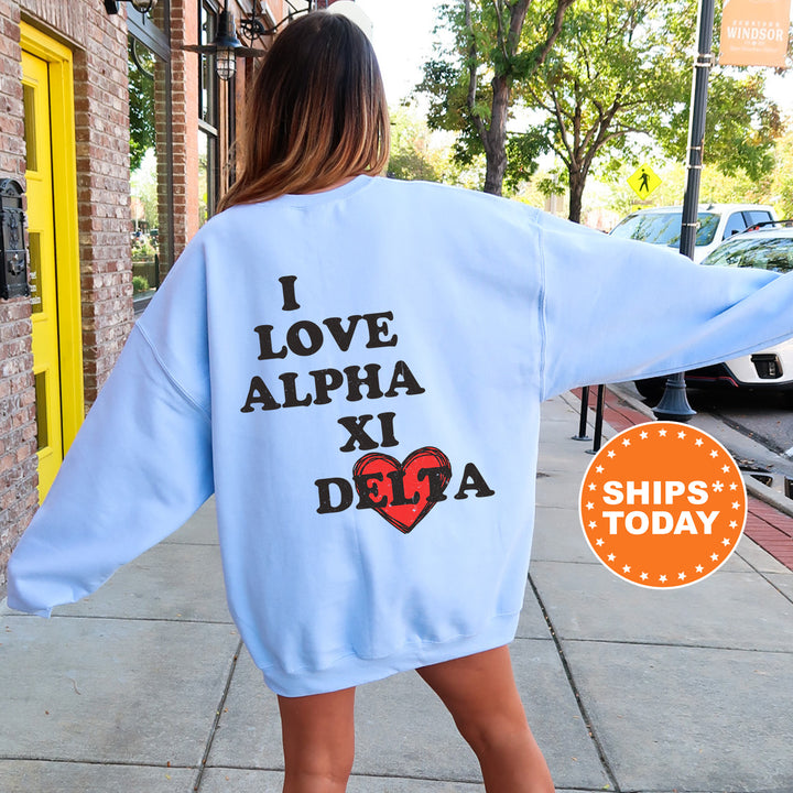 a woman walking down a sidewalk wearing a blue sweatshirt