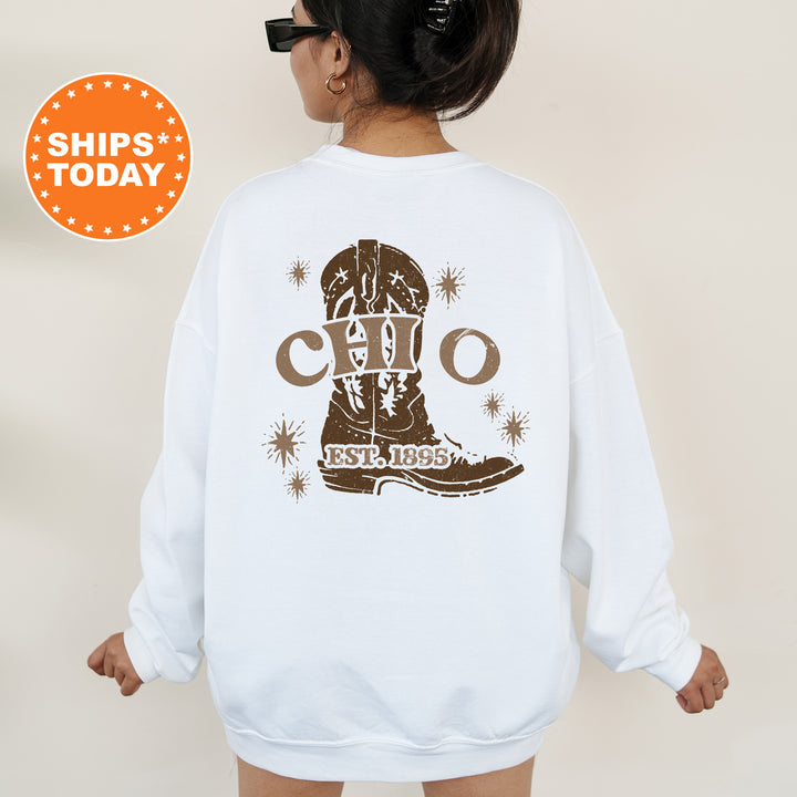 a woman wearing a white sweatshirt with a graphic of a boot