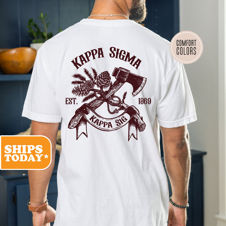 a man wearing a white shirt with a hammer and crossed axes on it