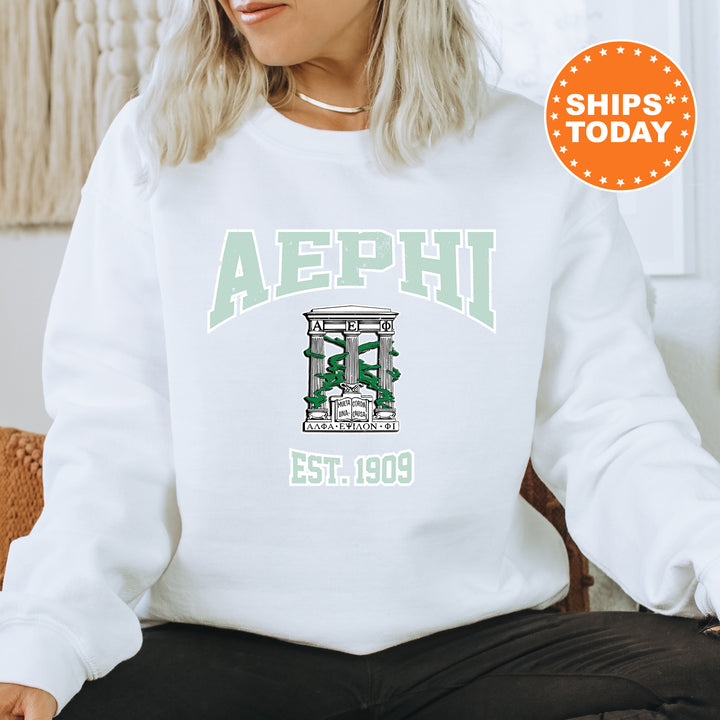 a woman sitting on a chair wearing a white sweatshirt