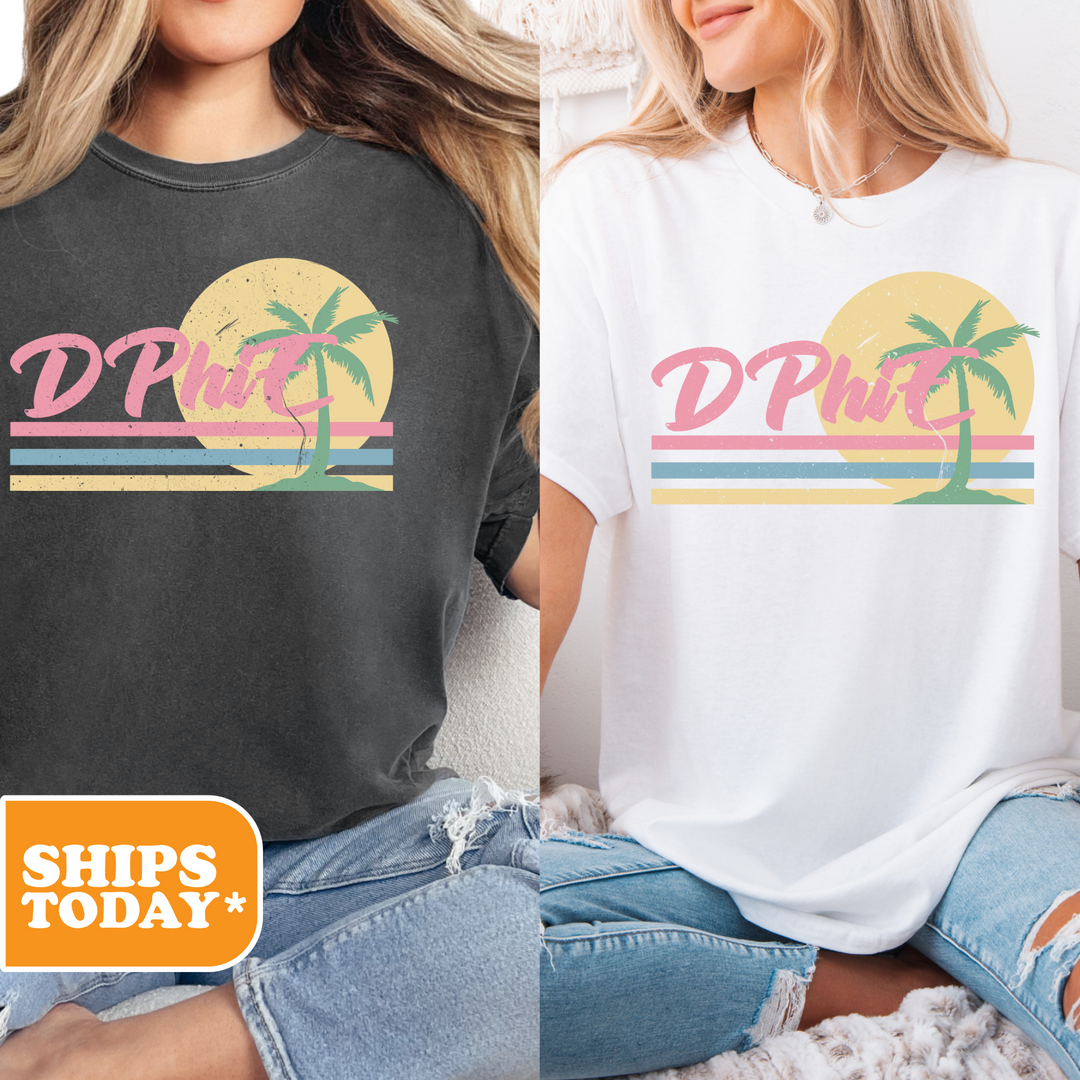two women sitting on a bed wearing matching shirts