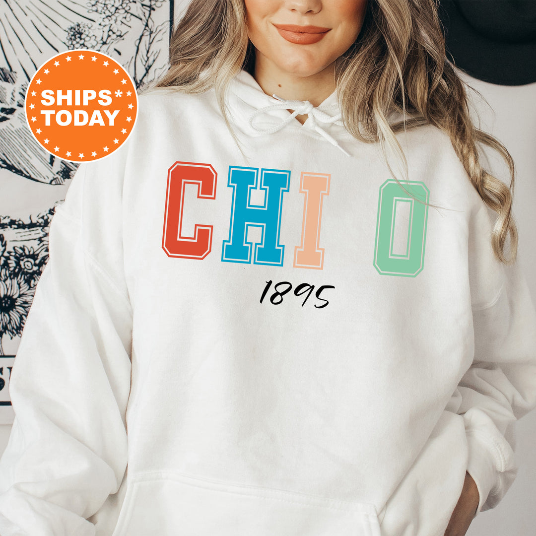 a woman wearing a white hoodie with the word chio printed on it