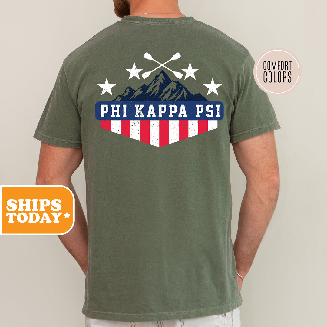 a man wearing a phi kapa psi t - shirt