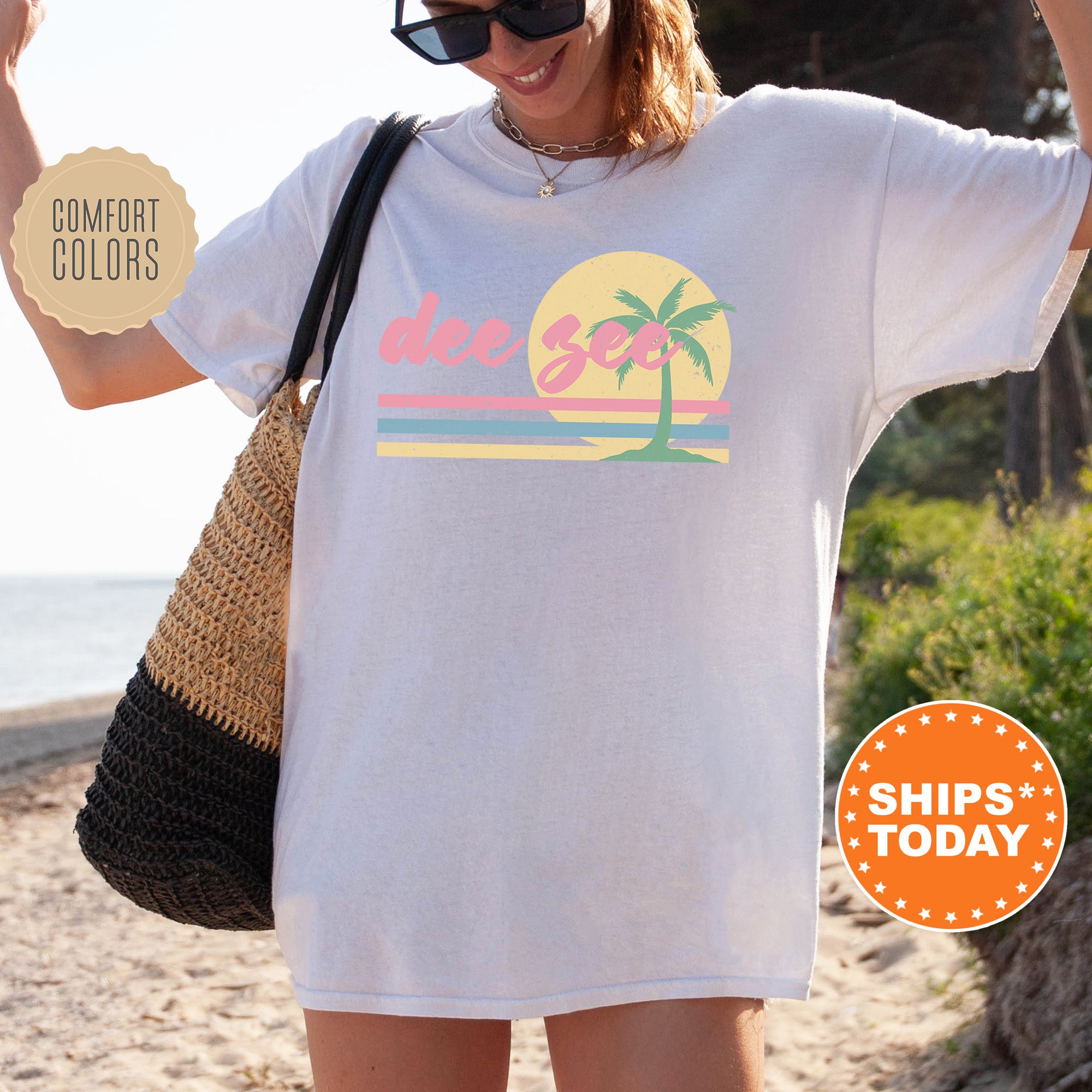 a woman wearing a white shirt with a palm tree on it