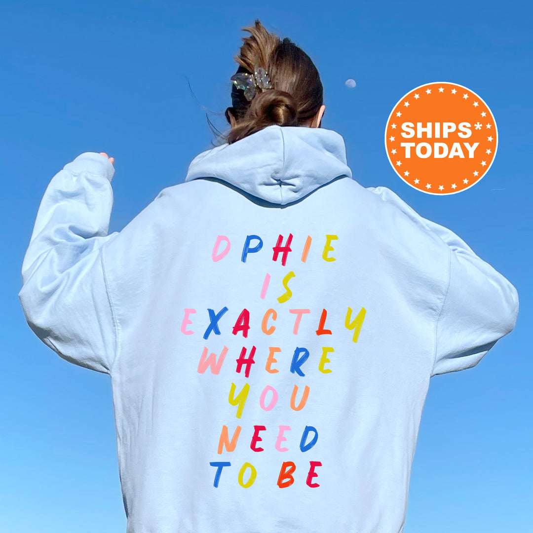 a woman wearing a white hoodie with the words dophiie is exactly where