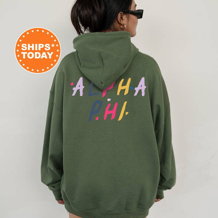 a woman wearing a green hoodie with the words ah ah on it